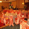 orange satin chair and table covers